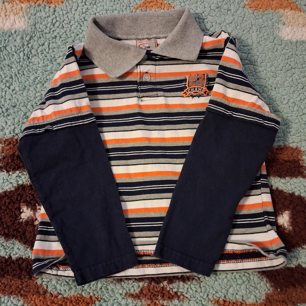 Champs Kids Polo with Navy and Orange Stripes